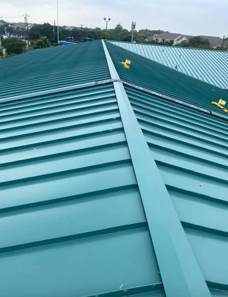 Green commercial metal roof ridge and valley for Metal Roof Repair in Astoria